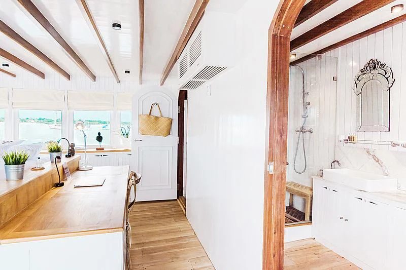 a kitchen with a wood floor aboard MISCHIEF Yacht for Sale