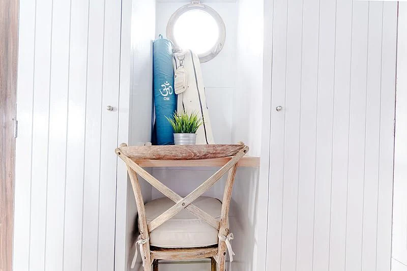 a chair and a table aboard MISCHIEF Yacht for Sale