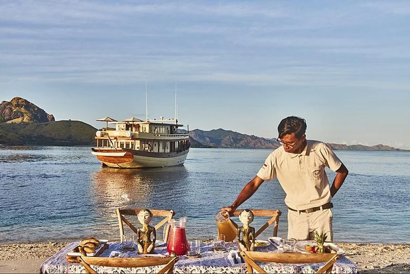 a man and a child on a boat aboard MISCHIEF Yacht for Sale