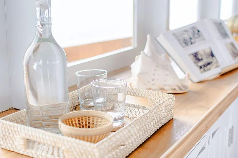 a basket of food and a bottle on a table aboard MISCHIEF Yacht for Sale