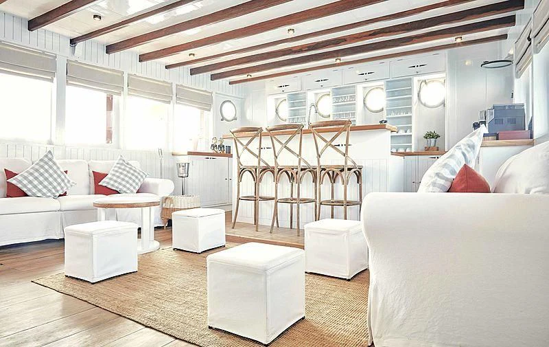 a room with a bunk bed and a couch aboard MISCHIEF Yacht for Sale