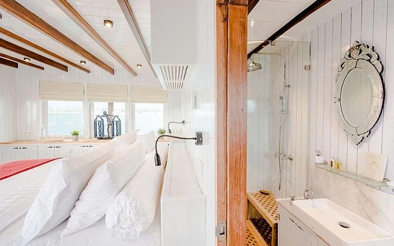 a bathroom with a mirror and a sink aboard MISCHIEF Yacht for Sale
