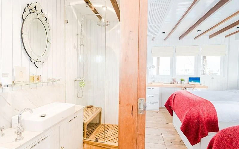 a room with a sink and a bed aboard MISCHIEF Yacht for Sale