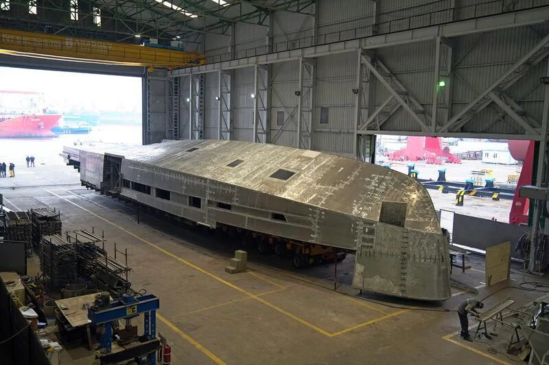 a large metal machine in a factory aboard AISHA Yacht for Sale