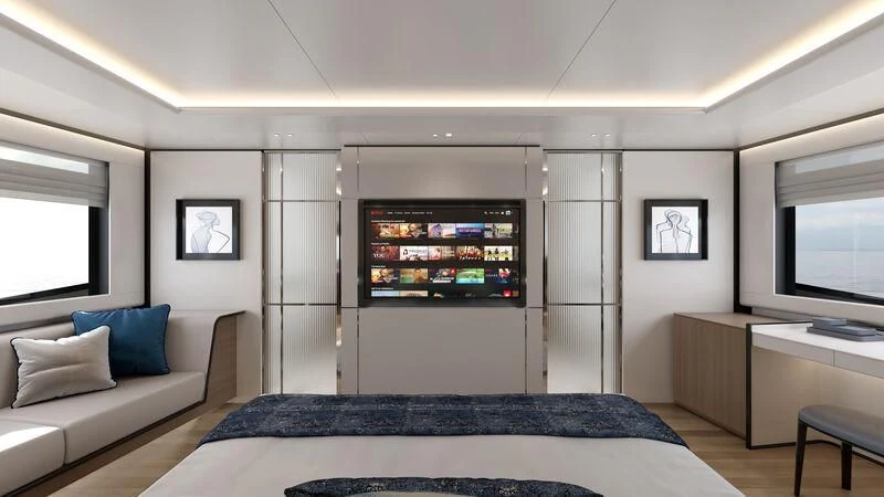 a bedroom with a bed and a tv aboard AISHA Yacht for Sale