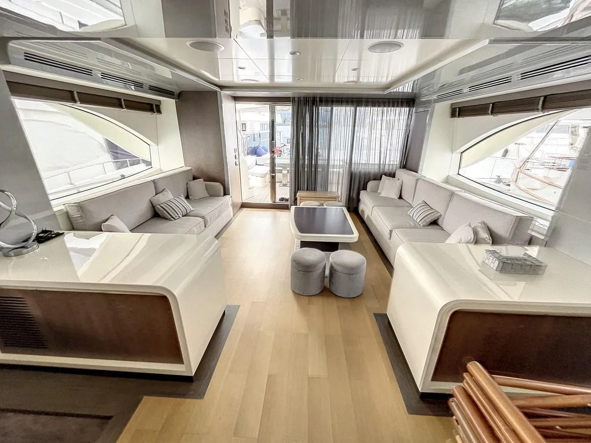 a room with a bed and a couch aboard LA FENICE Yacht for Charter