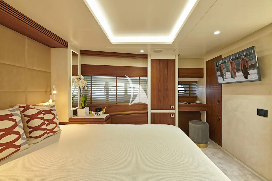 a bed in a room aboard LA FENICE Yacht for Charter