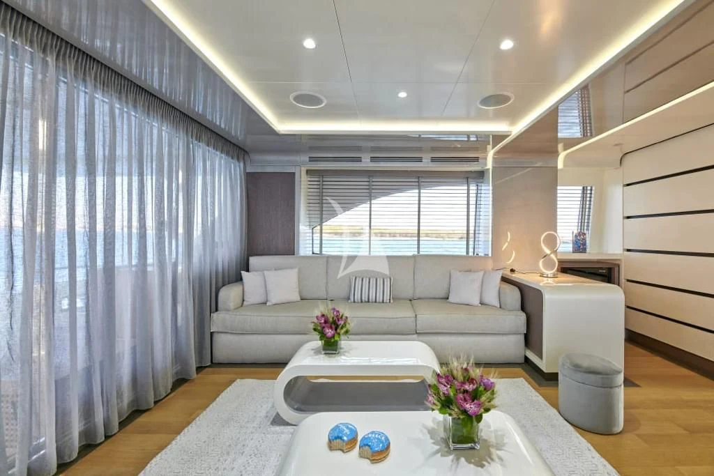 a living room with a couch and a table aboard LA FENICE Yacht for Charter