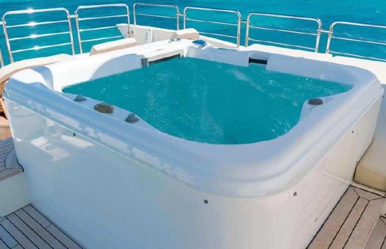 a pool with a chair and a table aboard LA FENICE Yacht for Charter
