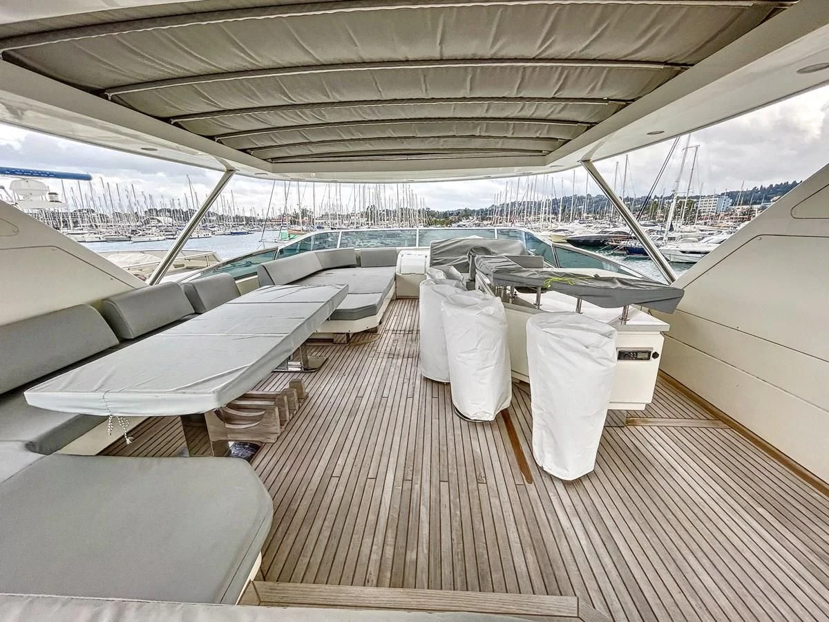 a deck with chairs and tables aboard LA FENICE Yacht for Charter