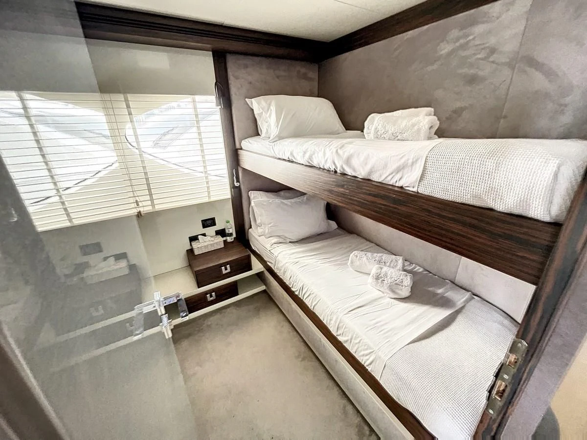 a room with two beds aboard LA FENICE Yacht for Charter