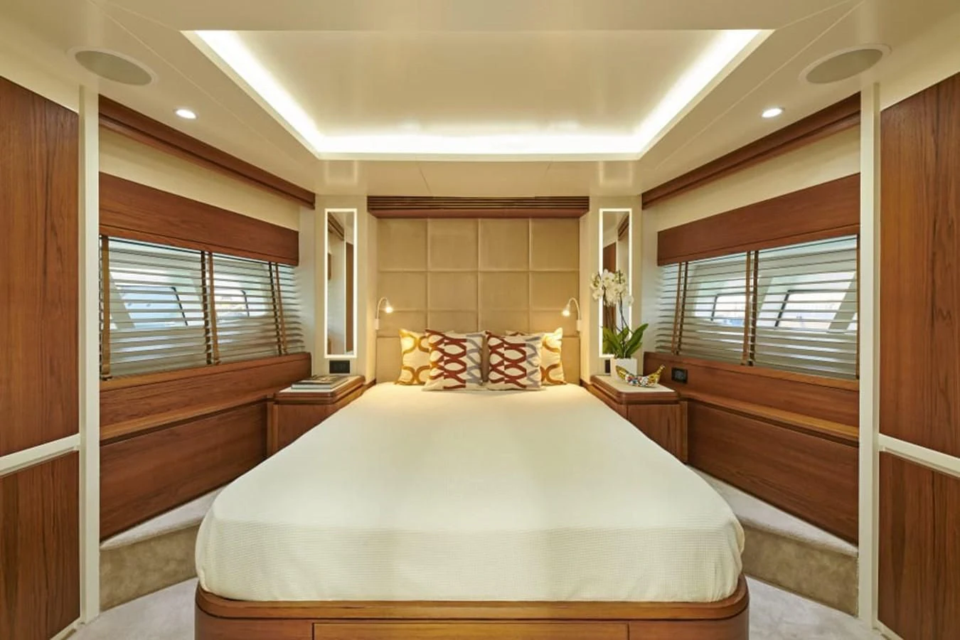 a bedroom with a bed and a window aboard LA FENICE Yacht for Charter