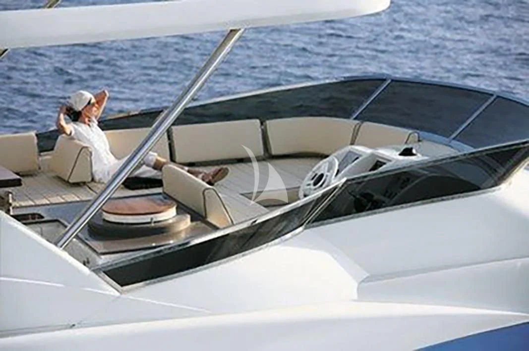 a person driving a boat aboard LA FENICE Yacht for Charter
