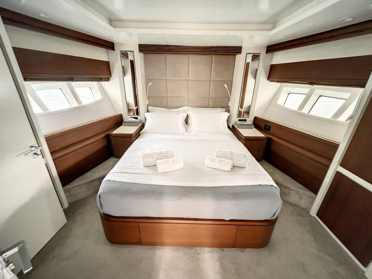 a bed in a room aboard LA FENICE Yacht for Charter