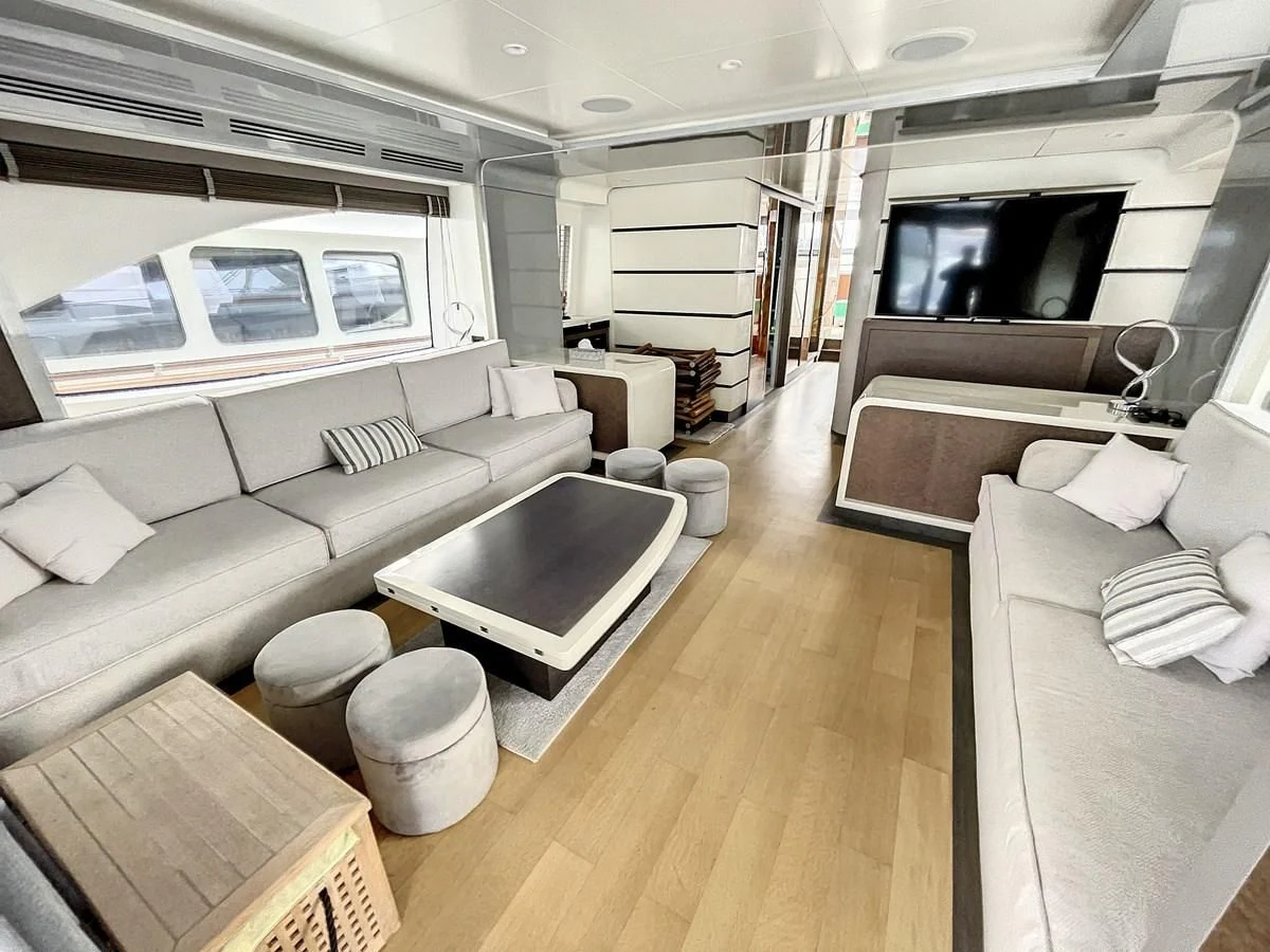 a living room with a large window aboard LA FENICE Yacht for Charter