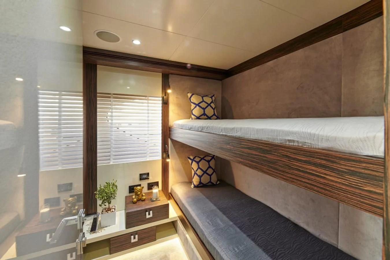 a bedroom with a bed and a window aboard LA FENICE Yacht for Charter