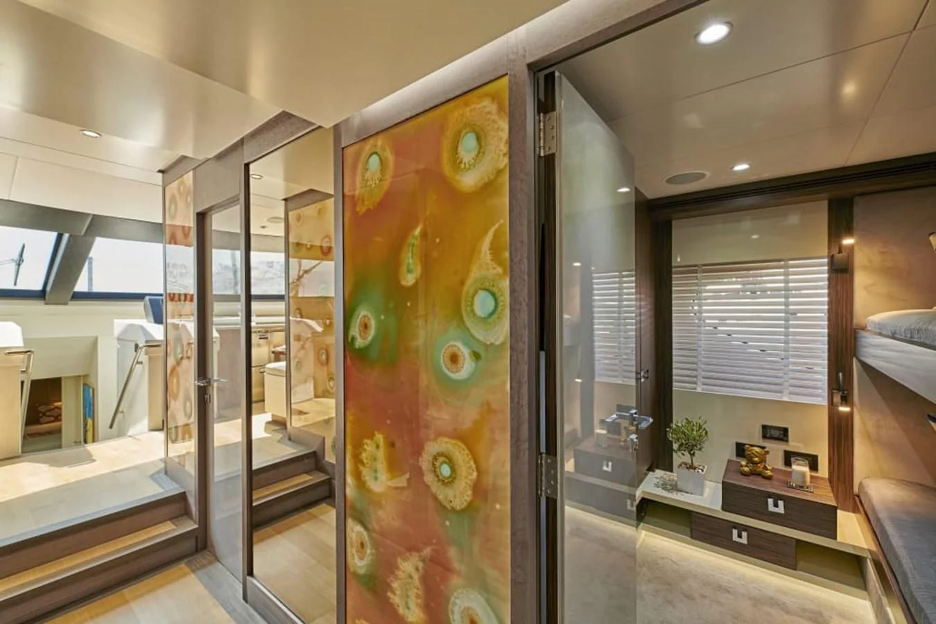 a large glass display case in a room with a large window aboard LA FENICE Yacht for Charter