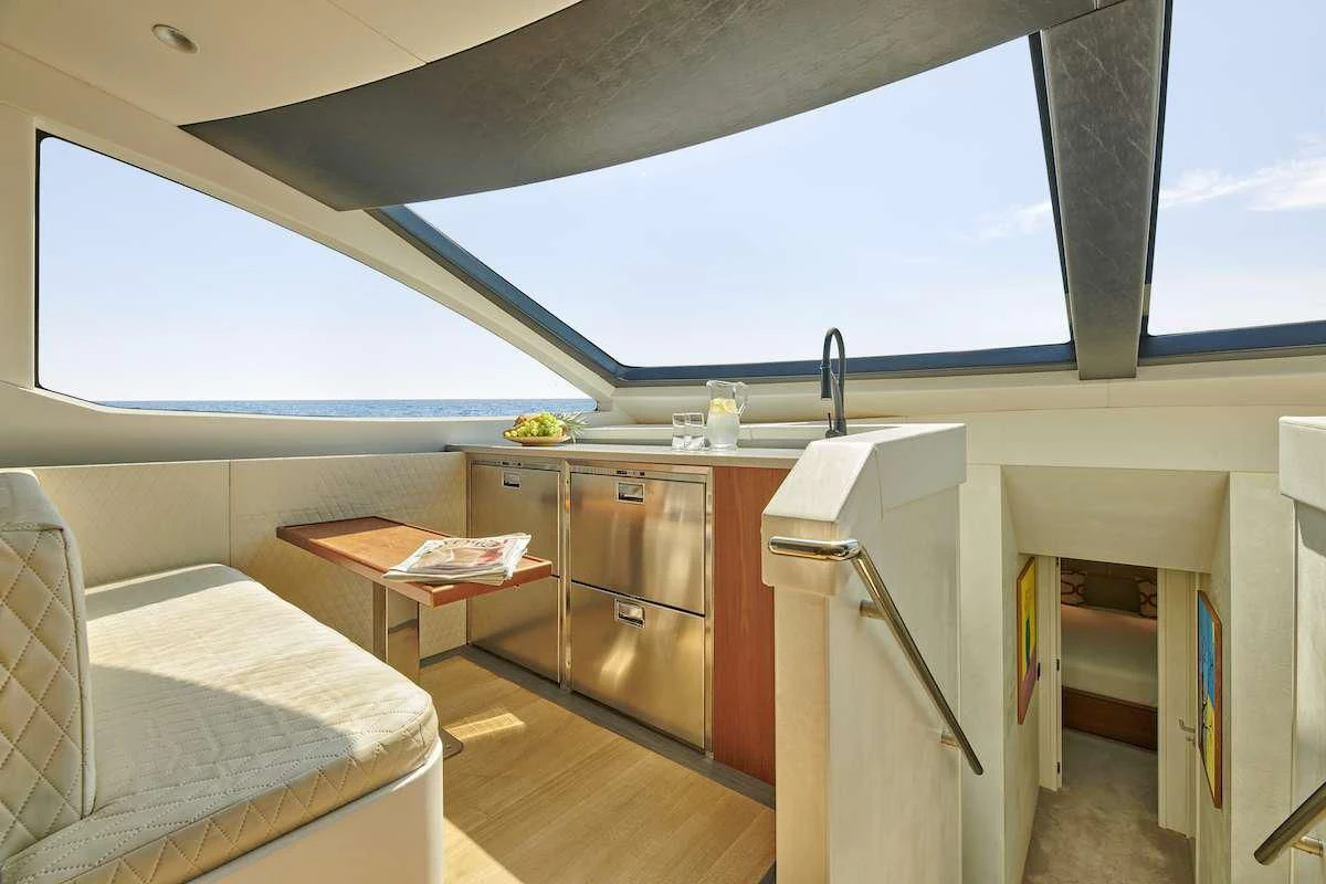 a room with a bed and a table aboard LA FENICE Yacht for Charter