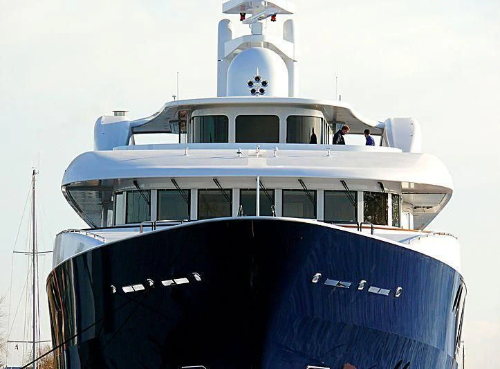 a large white boat with a couple of people on it aboard ARCHIMEDES Yacht for Sale