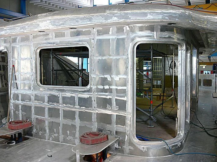 a large white building with a glass door aboard ARCHIMEDES Yacht for Sale