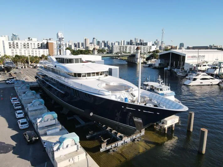 a large ship docked at a pier aboard ARCHIMEDES Yacht for Sale