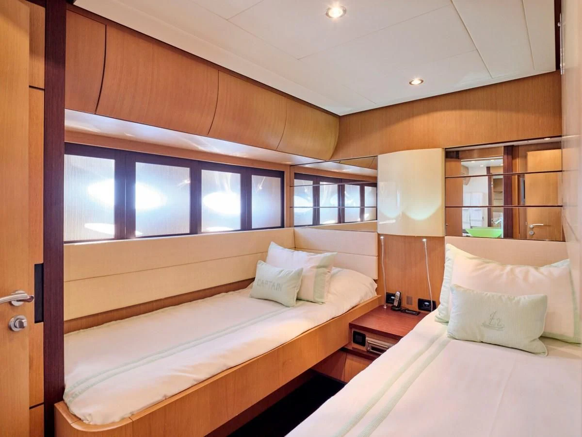 a room with two beds aboard ONE Yacht for Charter
