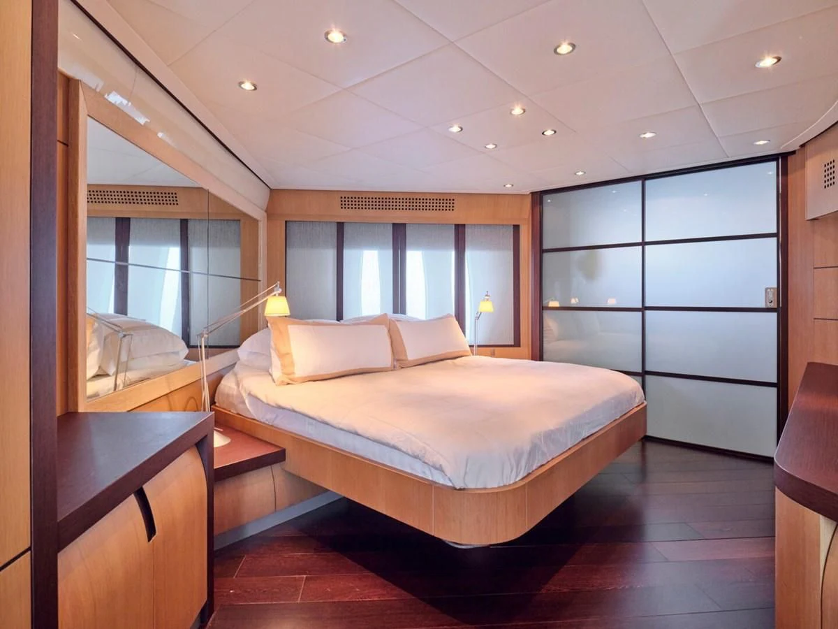 a bedroom with a large bed aboard ONE Yacht for Charter