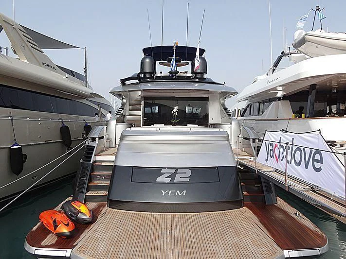 a boat docked at a pier aboard ONE Yacht for Charter