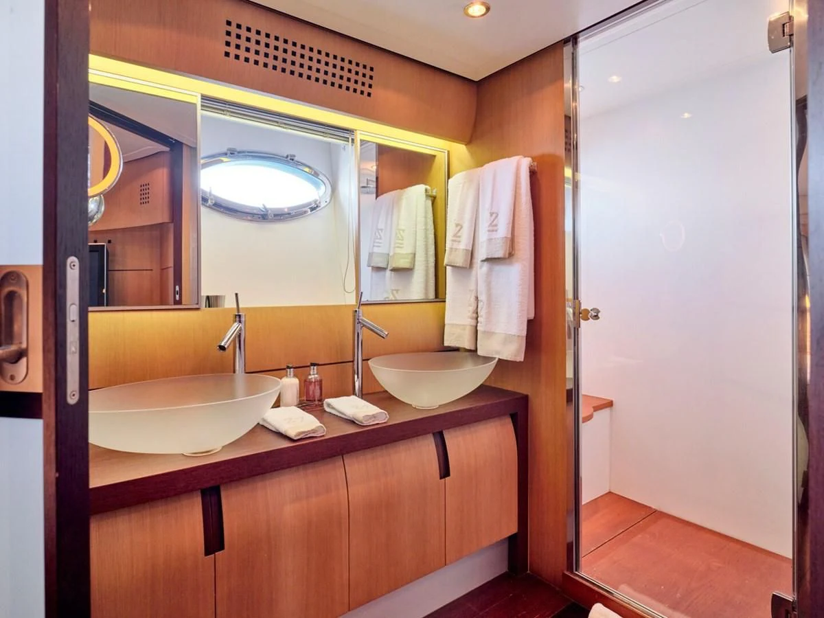 a bathroom with a sink and a mirror aboard ONE Yacht for Charter