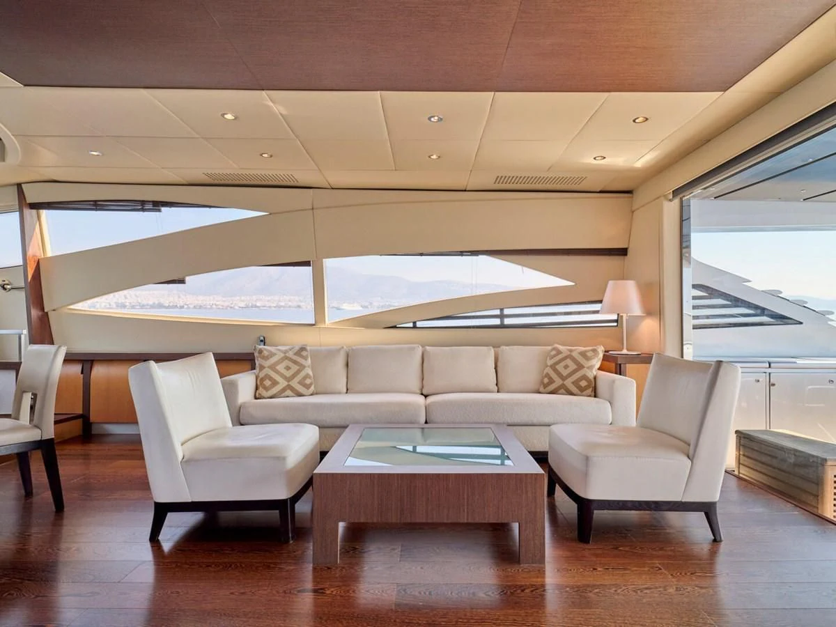 a living room with a large window aboard ONE Yacht for Charter