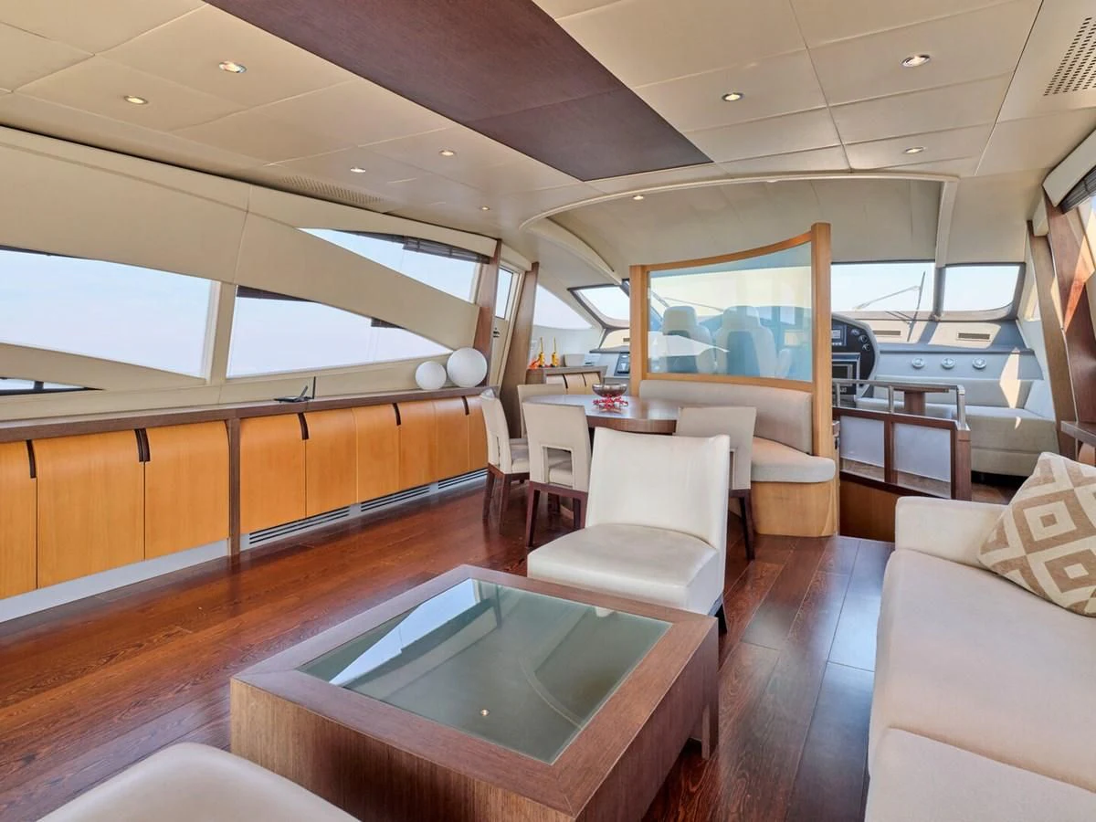 a room with a table and chairs aboard ONE Yacht for Charter