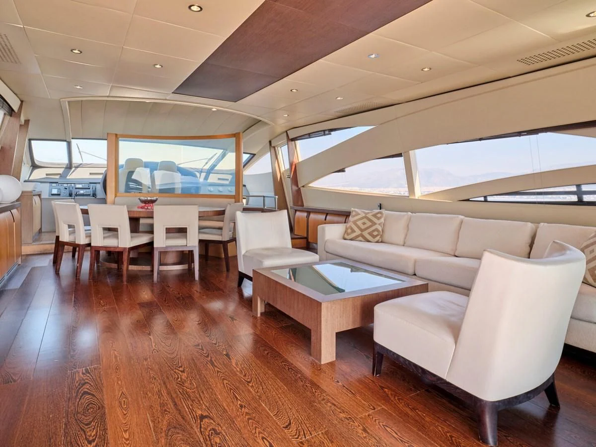 a living room with a couch and a table aboard ONE Yacht for Charter