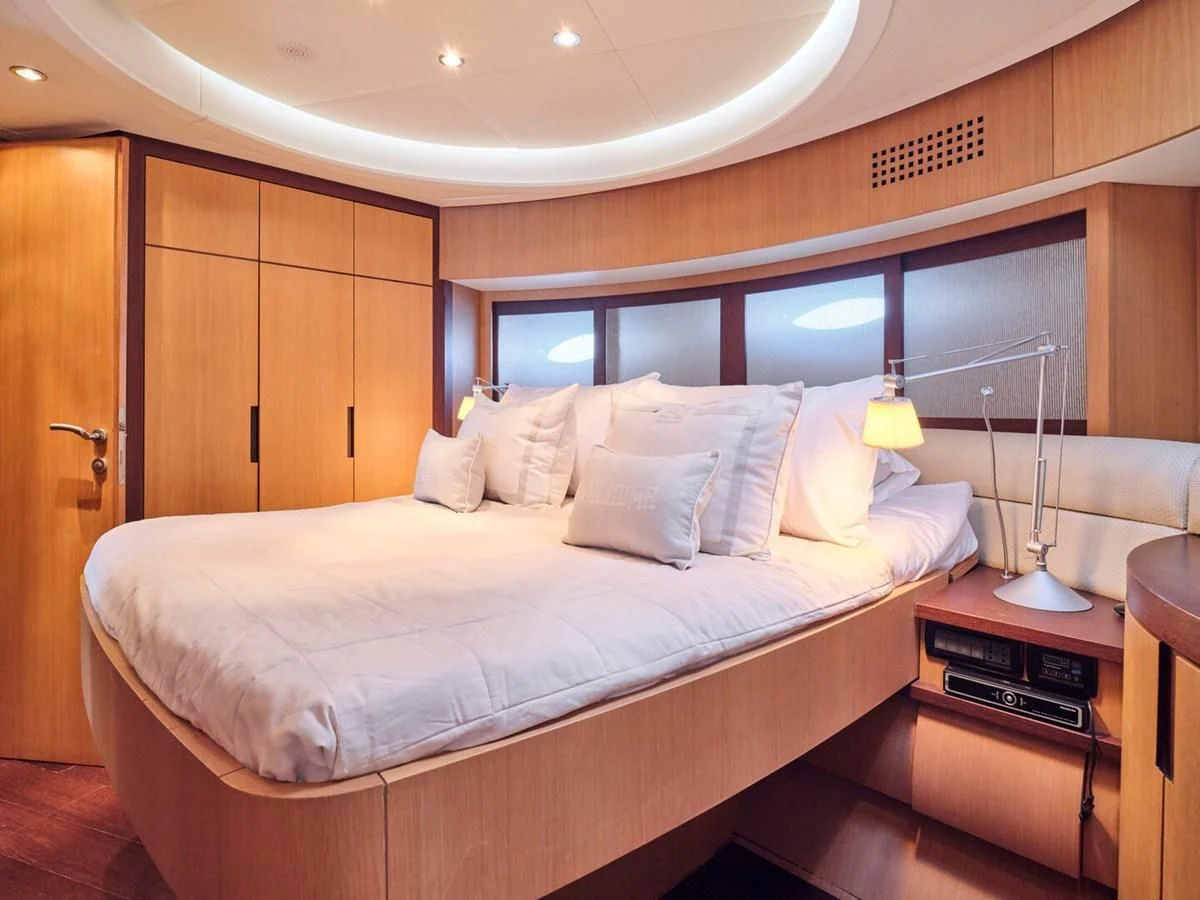 a bed in a room aboard ONE Yacht for Charter