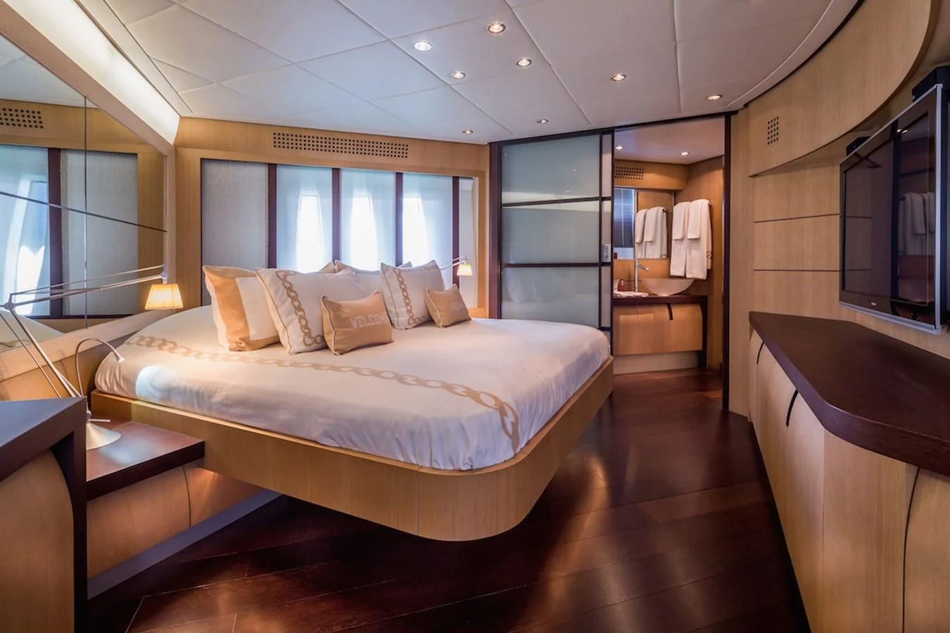 a large bedroom with a large bed aboard ONE Yacht for Charter