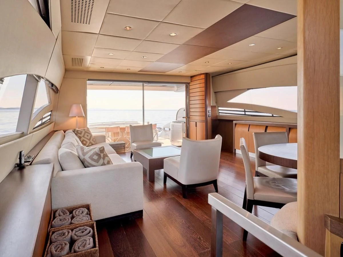 a living room with a large window aboard ONE Yacht for Charter