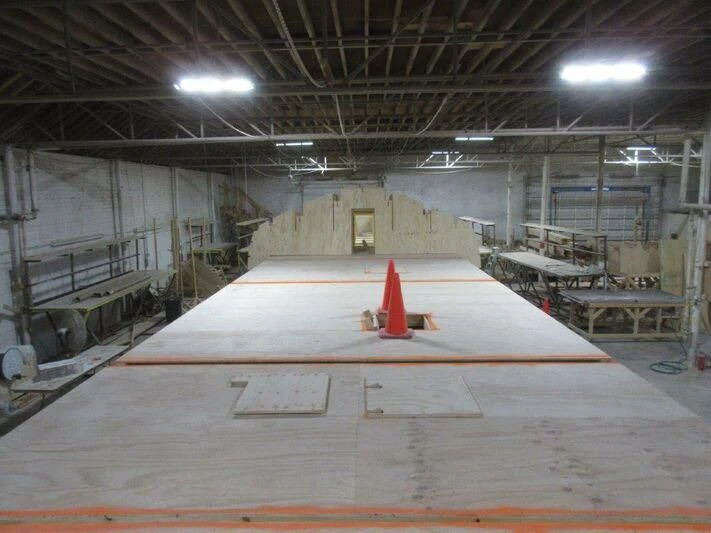 a large empty warehouse aboard JARRETT BAY 90/68 Yacht for Sale