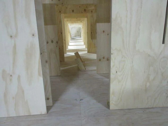 a room with white walls and a door aboard JARRETT BAY 90/68 Yacht for Sale