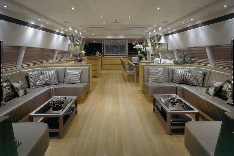 a living room with a wood floor aboard MARIA CARLA Yacht for Sale