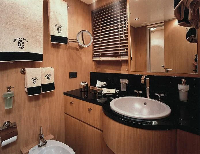 a bathroom with a sink and mirror aboard MARIA CARLA Yacht for Sale