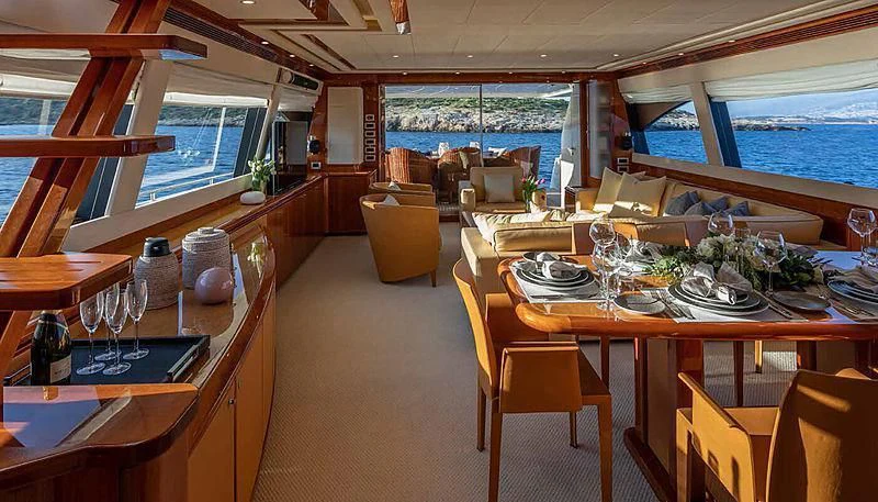 a dining room with a table and chairs aboard ASTARTE Yacht for Sale