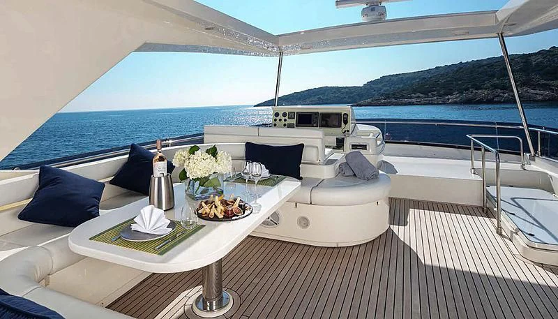 a white lounge chair on a deck overlooking a large body of water aboard ASTARTE Yacht for Sale