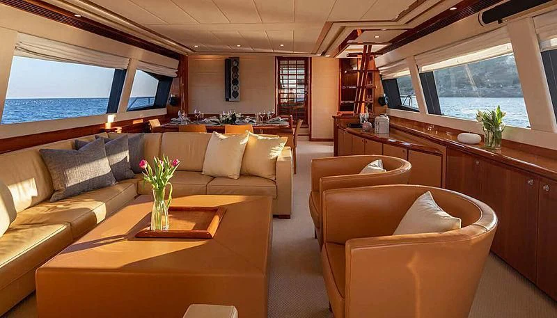 a living room with a table and chairs aboard ASTARTE Yacht for Sale