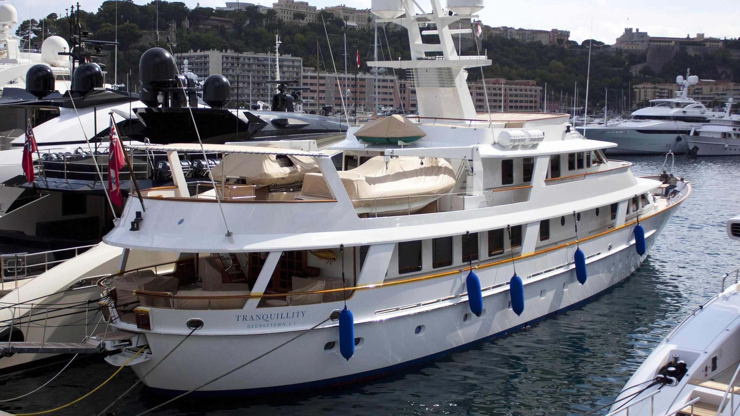 a boat docked in a harbor aboard TRANQUILLITY Yacht for Sale