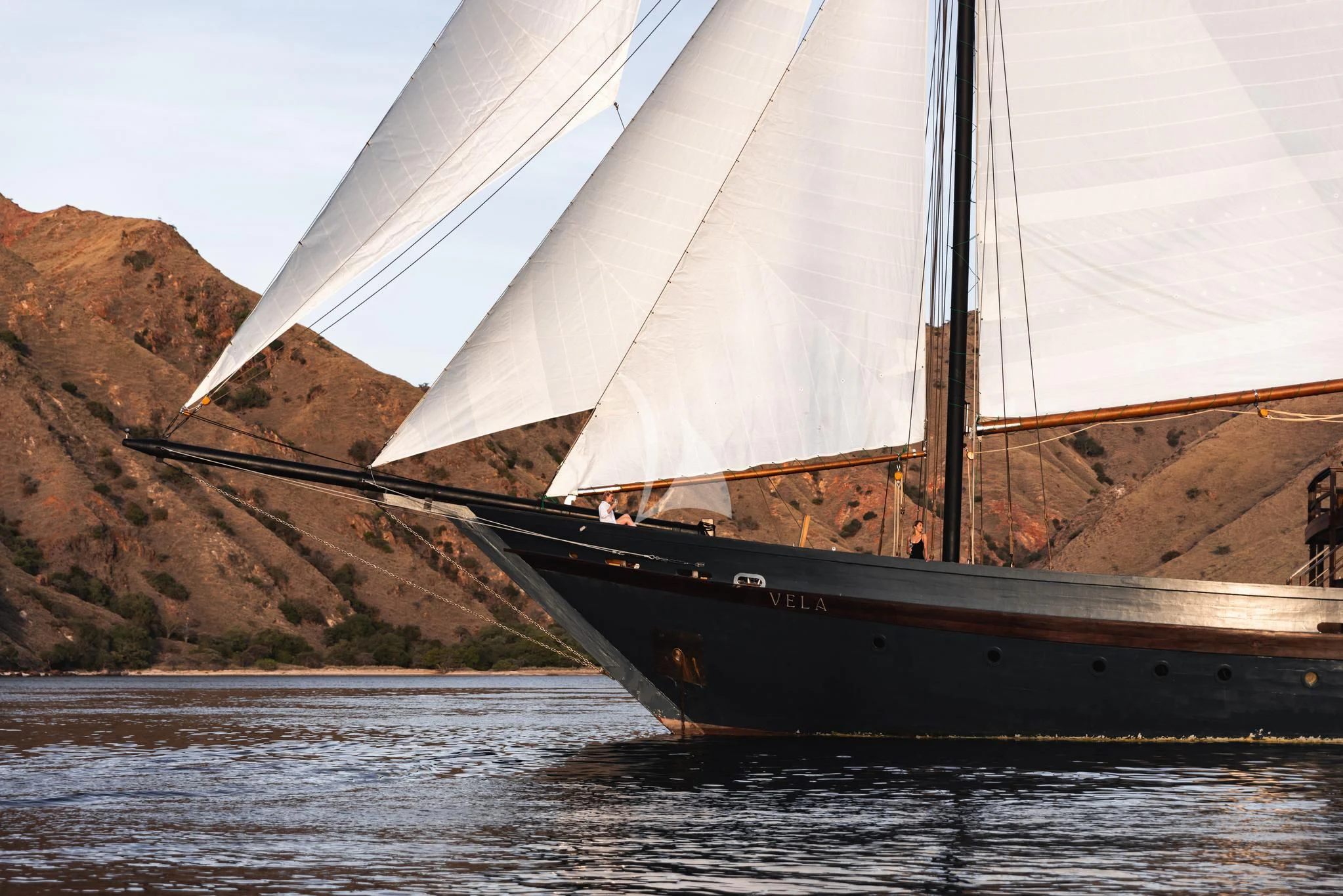 a boat on the water aboard VELA Yacht for Charter