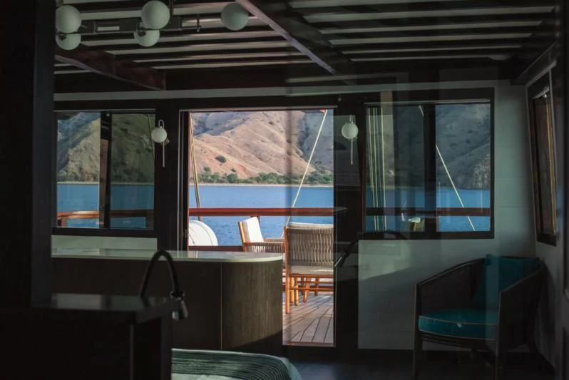 a room with a table and chairs aboard VELA Yacht for Charter