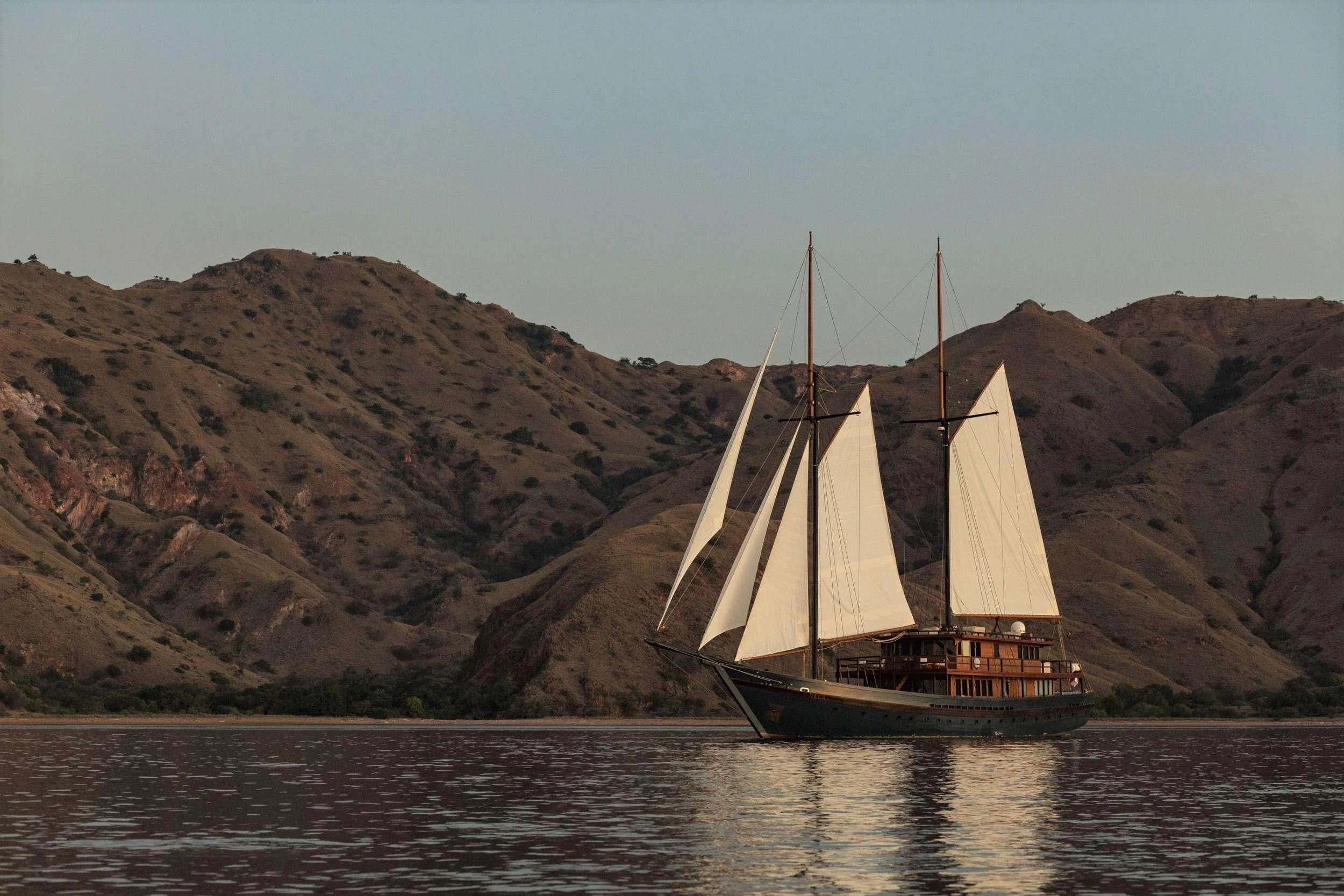 a sailboat on the water aboard VELA Yacht for Charter