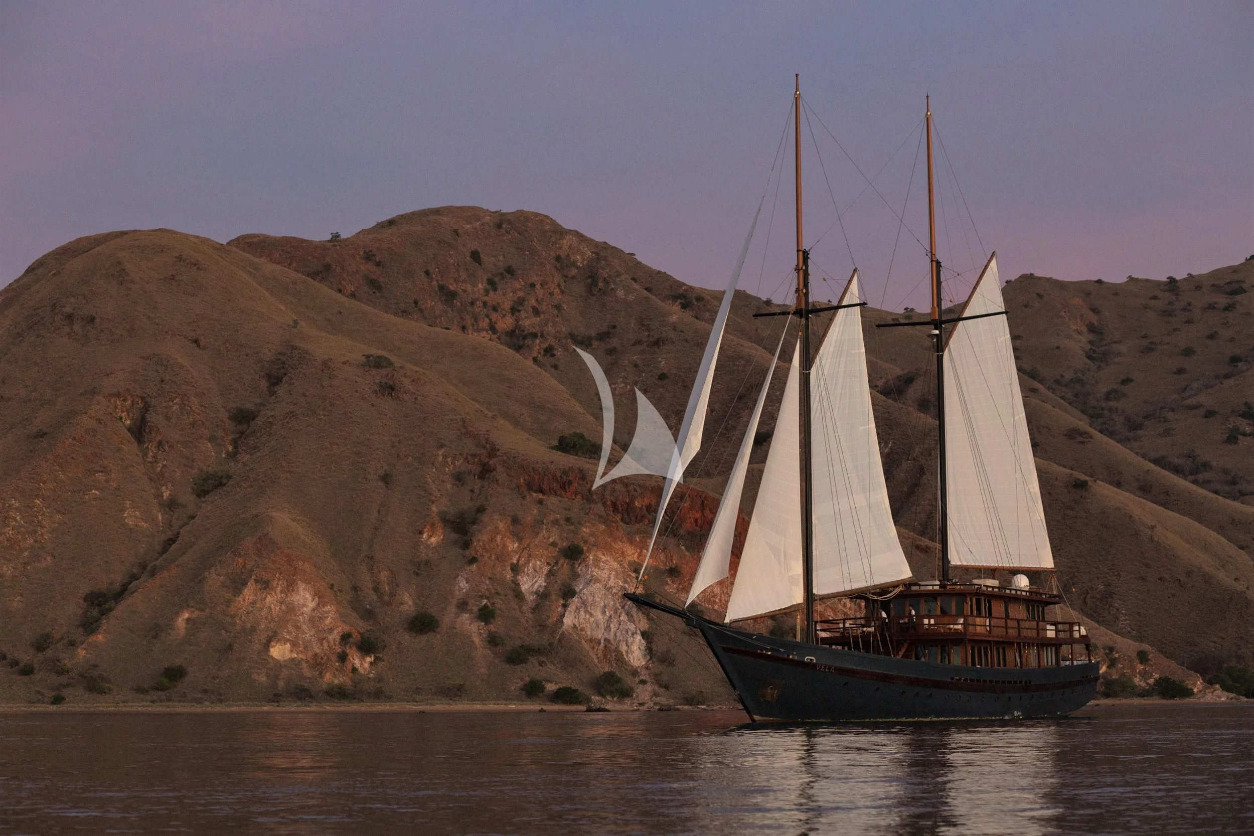 a sailboat on the water aboard VELA Yacht for Charter
