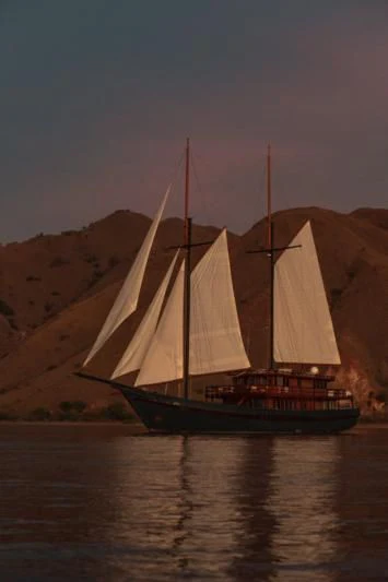 a sailboat on the water aboard VELA Yacht for Charter
