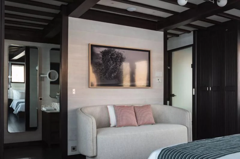 a couch in a room aboard VELA Yacht for Charter