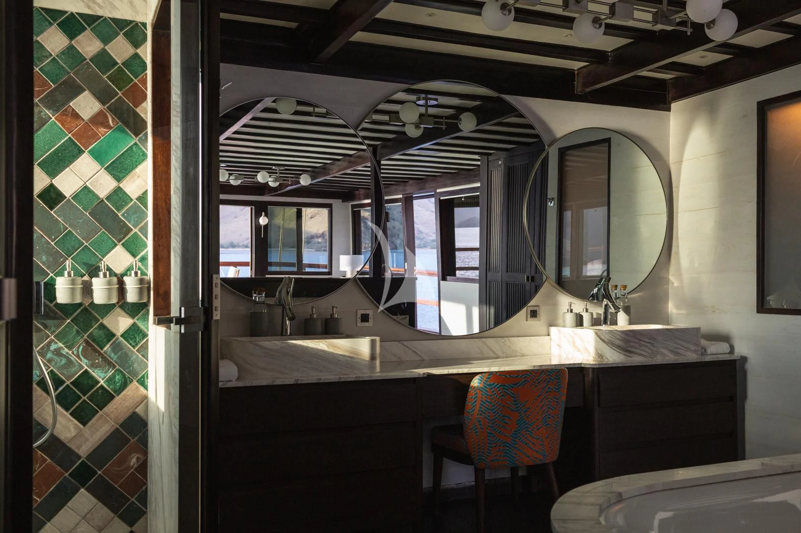 a bathroom with a large mirror aboard VELA Yacht for Charter